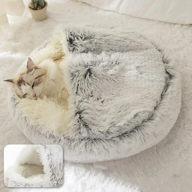 Chat qui dors dans un lit beignet